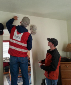 Installing smoke detectors in one Peoria home
